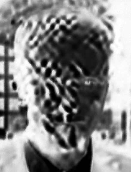 Rob Olson, Head Crop inverted and desaturated frame 02:34 